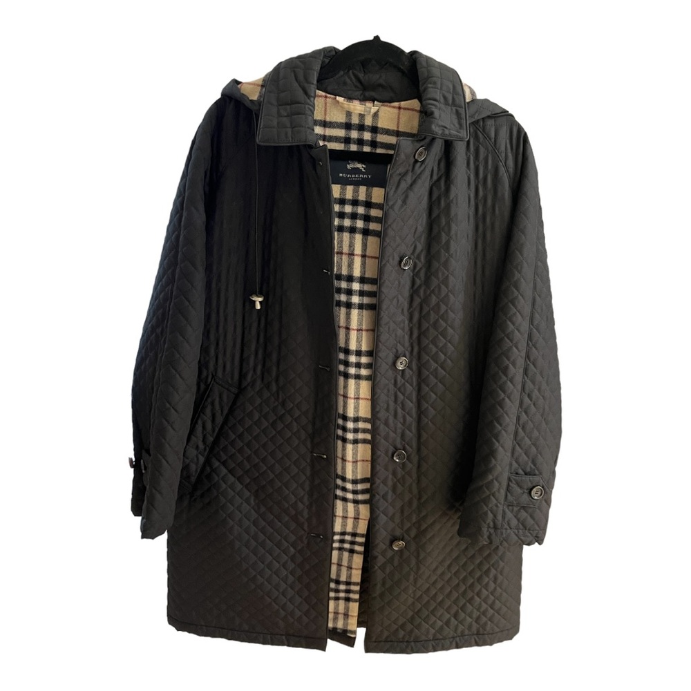 Burberry Women’s black diamond quilted wool lined hooded coat.